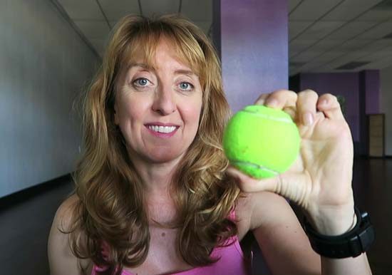 Woman holding a tennis ball