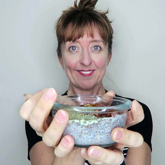 Woman holding bowl of chia pudding