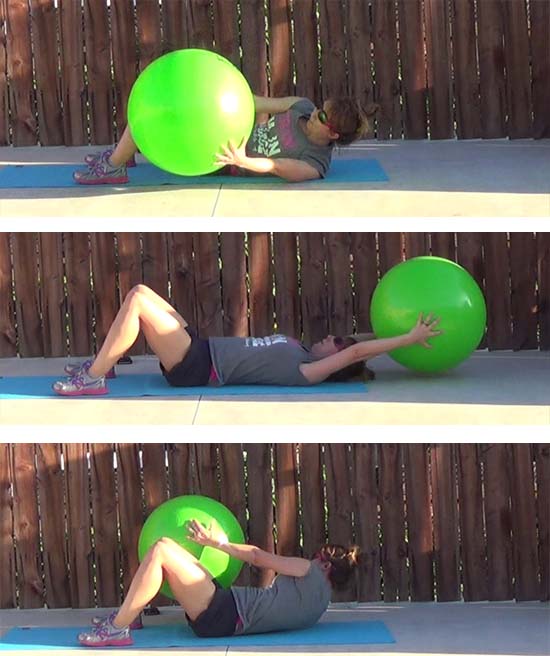 personal trainer performing oblique crunch core exercise with stability ball