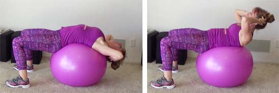 personal trainer performing abdominal crunch on a pink stability ball