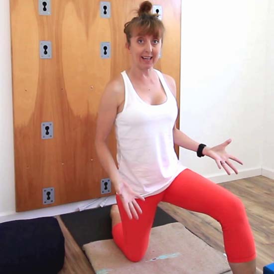 Yoga teacher kneeling lunge on yoga mat