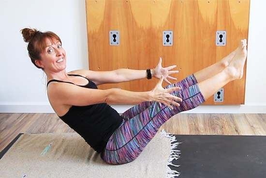 boat pose with both legs extended and arms reaching forward