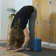 yoga teacher demonstrating standing forward fold