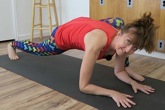 yoga teacher demonstrating lizard pose
