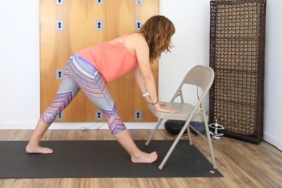pyramid pose using an office chair for a support