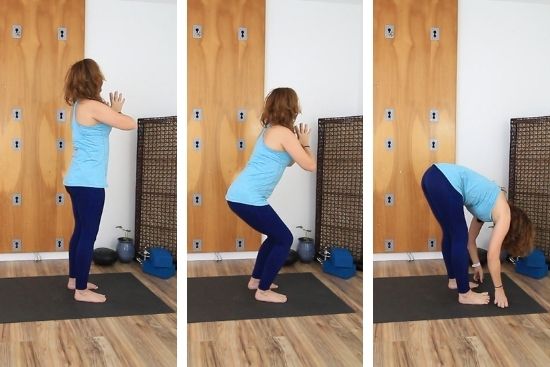 yoga teacher dressed in blue demonstrating poses on a yoga ma