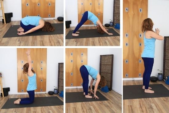 yoga teacher dressed in blue demonstrating poses on a yoga mat