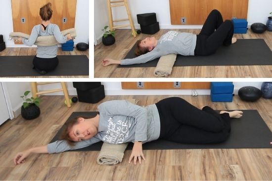 woman on yoga mat with a blanket