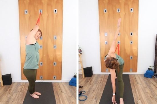 yoga teacher demonstrating strap assisted poses