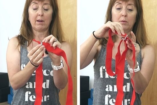 yoga teacher demonstrating how to tie a yoga strap