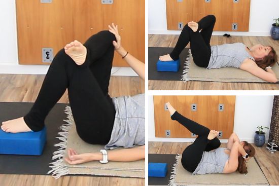 yoga teacher on a yoga mat demonstrating yoga exercises